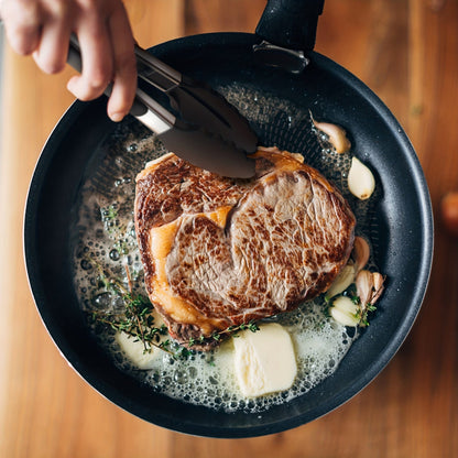 Tong de cuisine en acier inoxydable avec embouts en silicone noirs